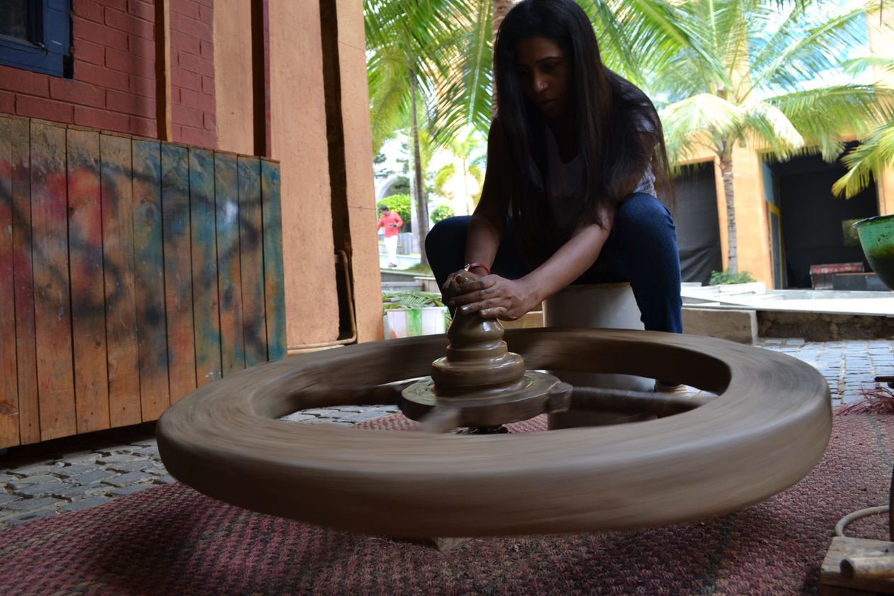 Woman doing pottery, turning a creative hobby into a business