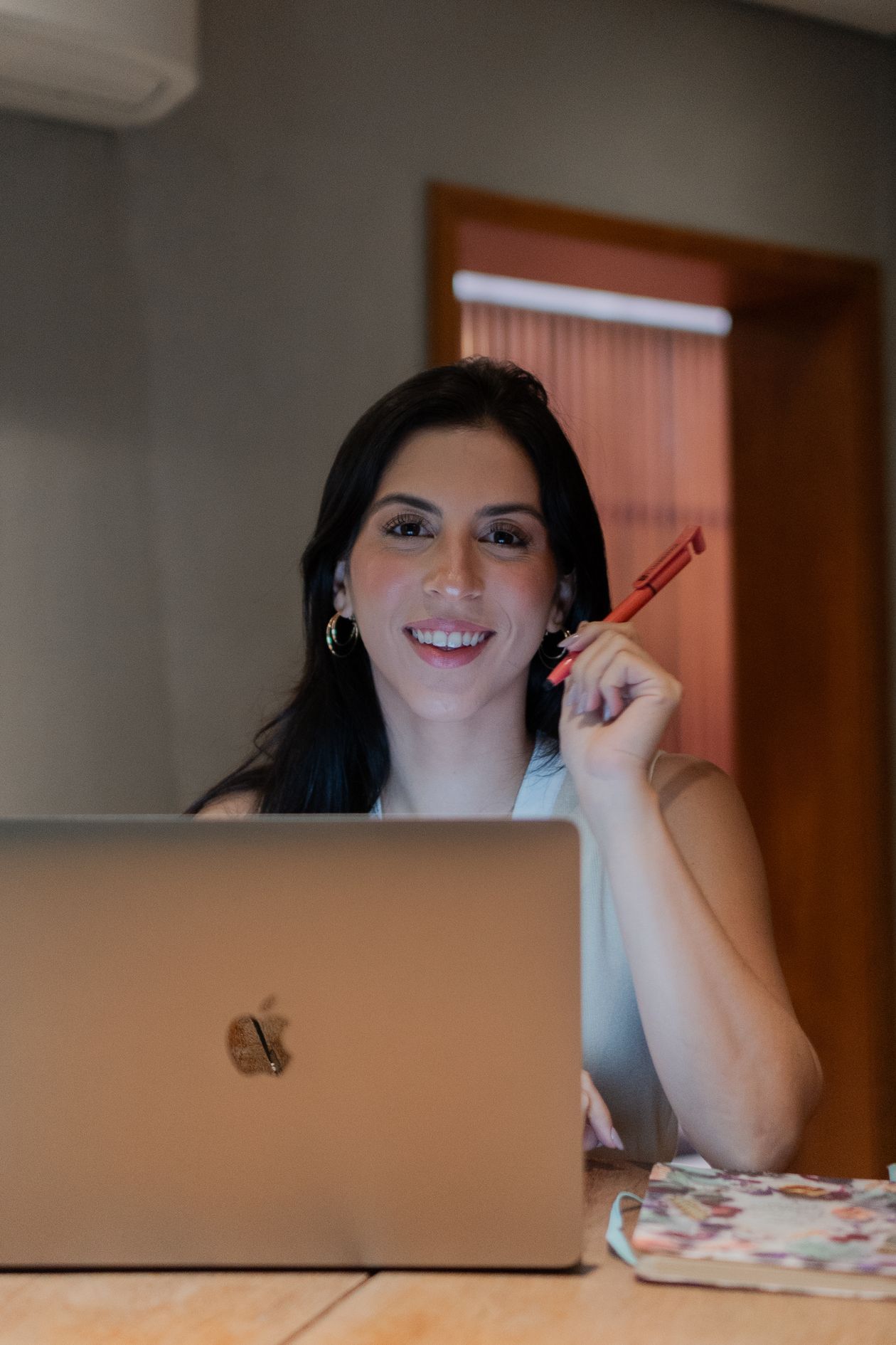 Confident woman over 40 working on a laptop, building a side hustle