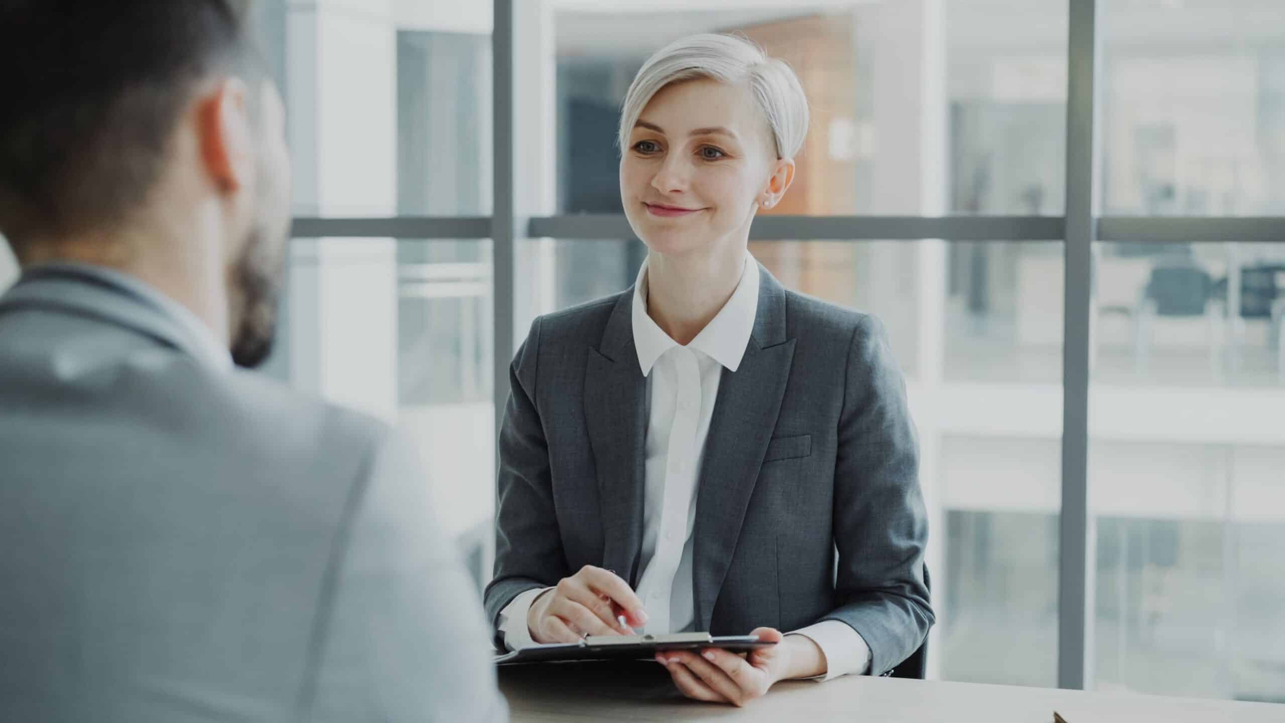 Woman answering questions confidently in a job interview