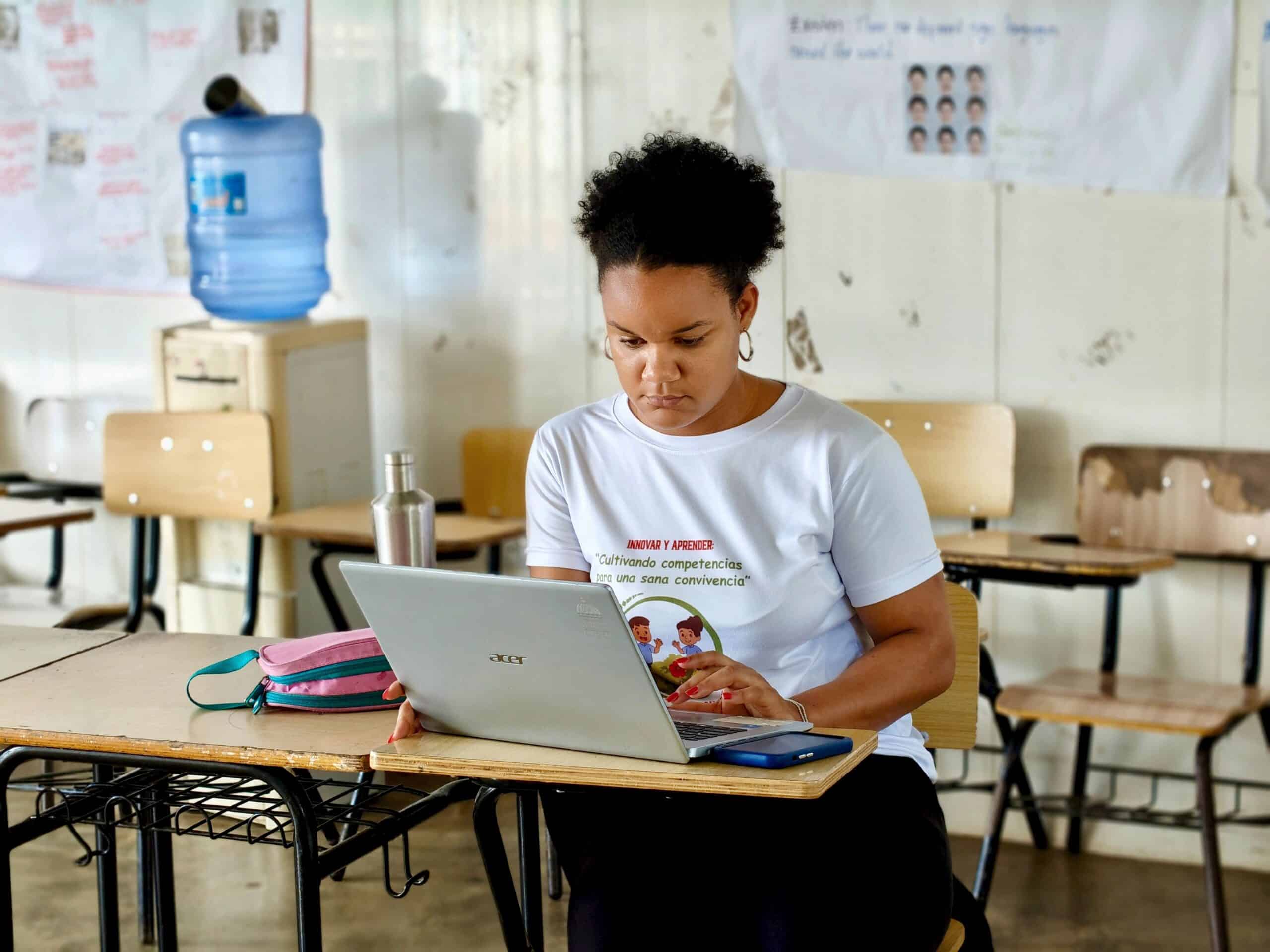 Woman learning a new skill on her laptop to stay current