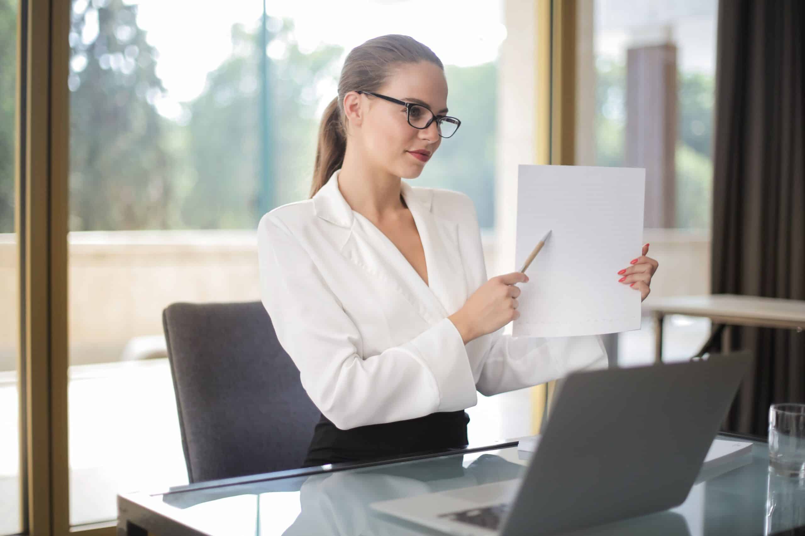 Confident businesswoman reviewing documents, practical strategies for ageism in job search