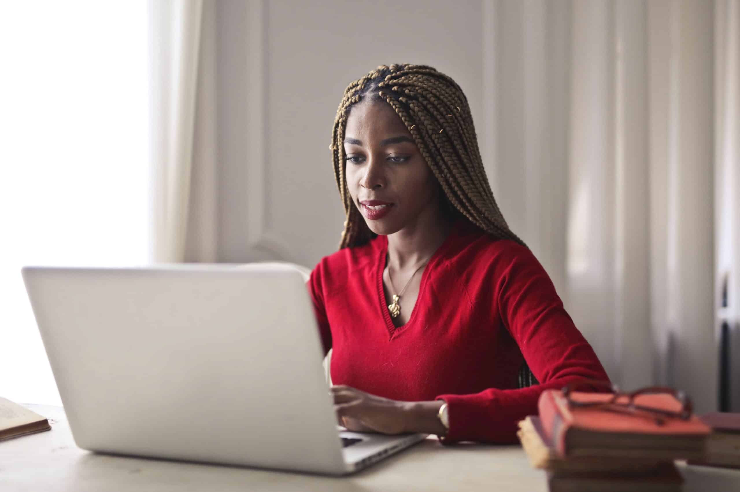 Woman focused on her laptop while sending job applications