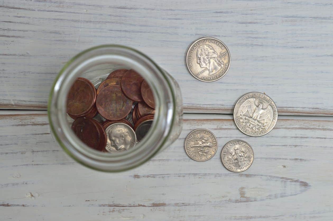 Coins inside a jar, representing retirement contributions building back up