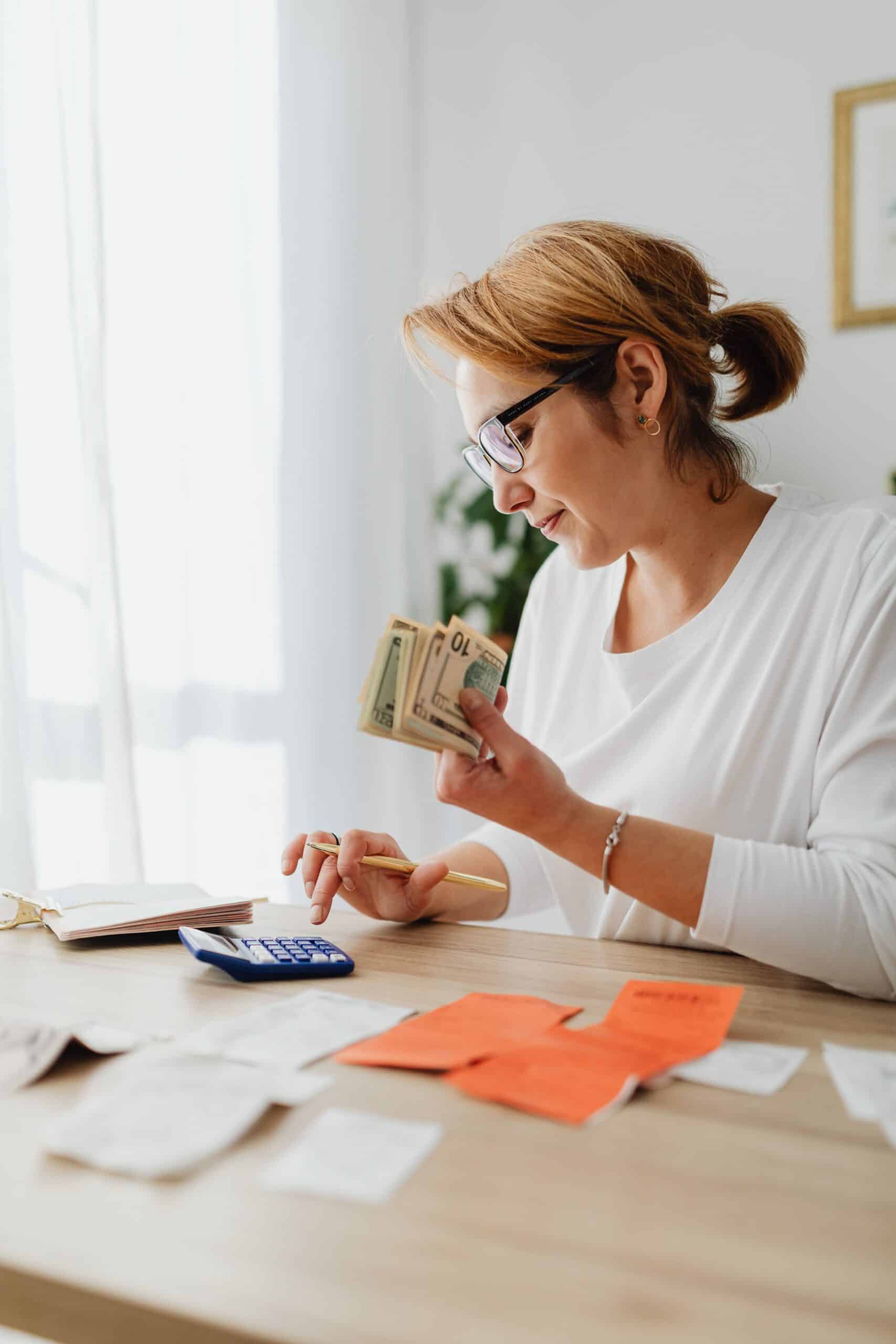 Woman reviewing her budget and finances at home