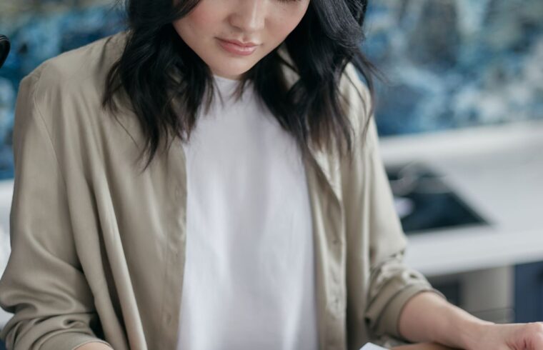 Woman reviewing bills and budget while planning to start a business