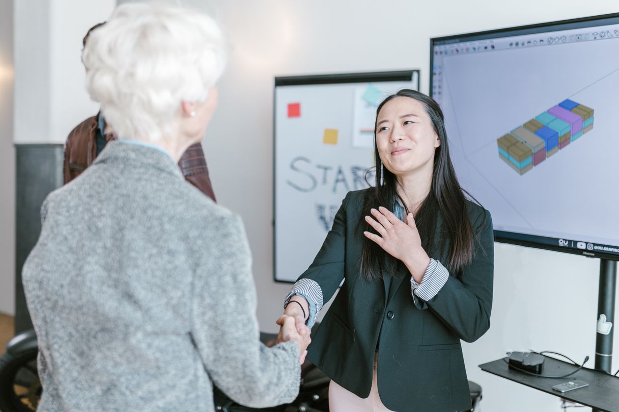 Two women in agreement during a meeting