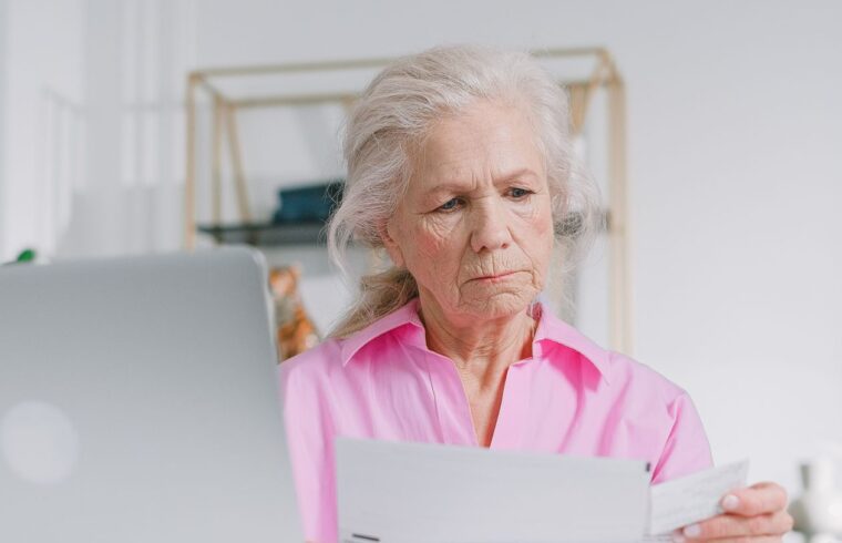 Woman looking at retirement account documents