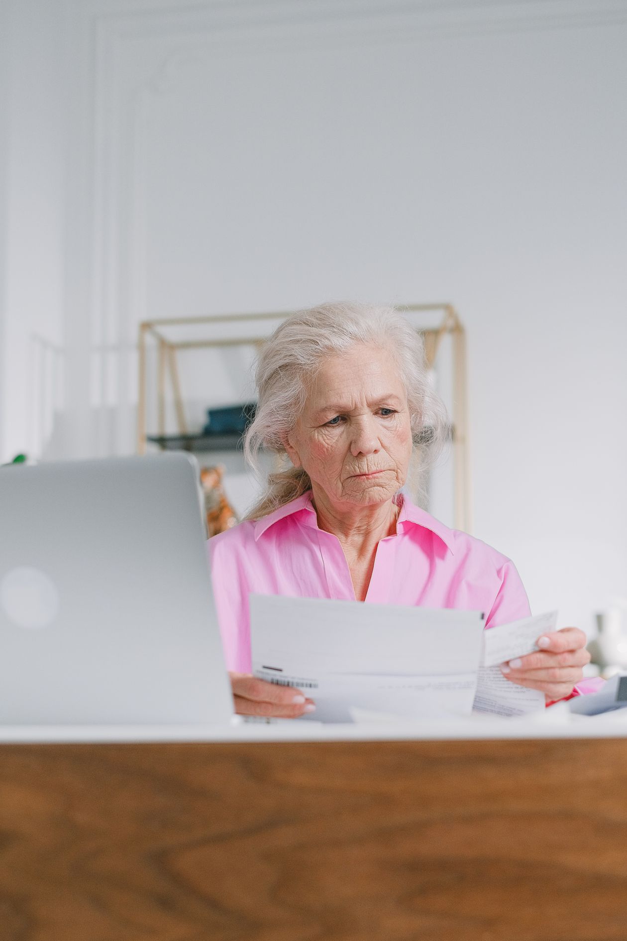 Woman looking at retirement account documents