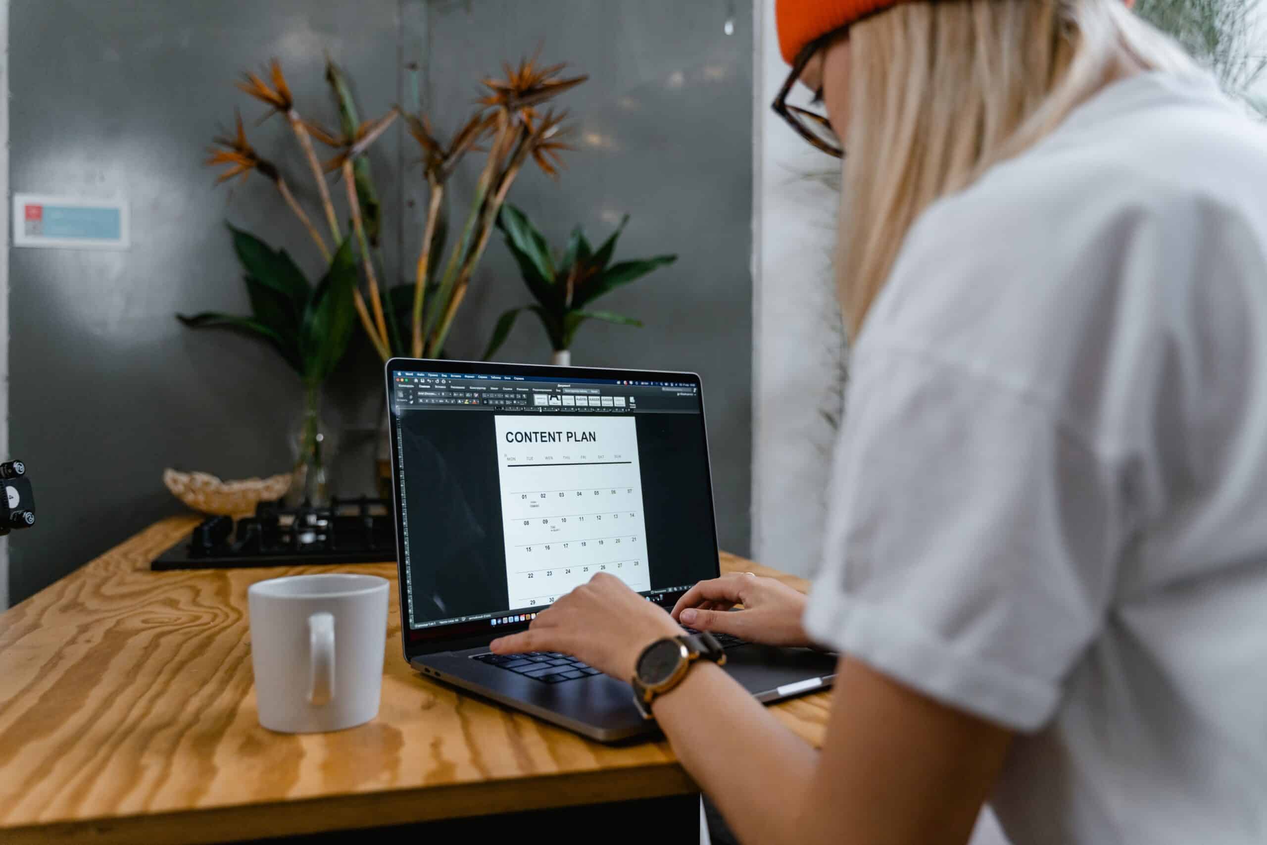 Woman using a laptop, writing resume tips for older workers