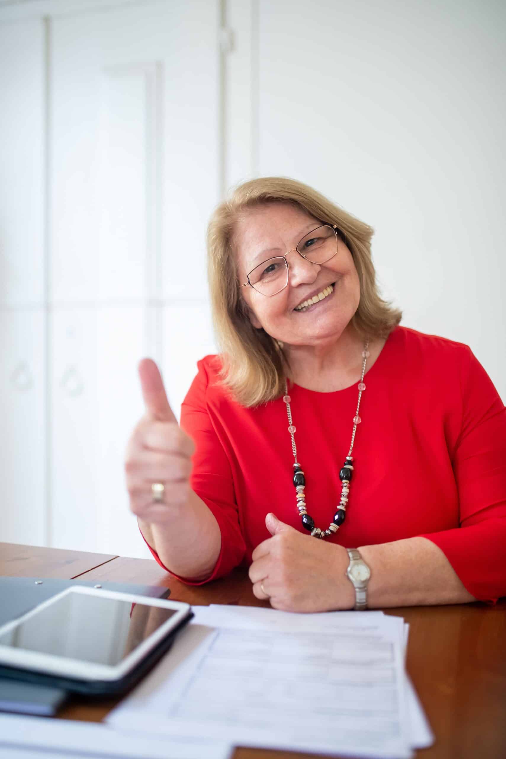 happy senior woman giving a thumbs up