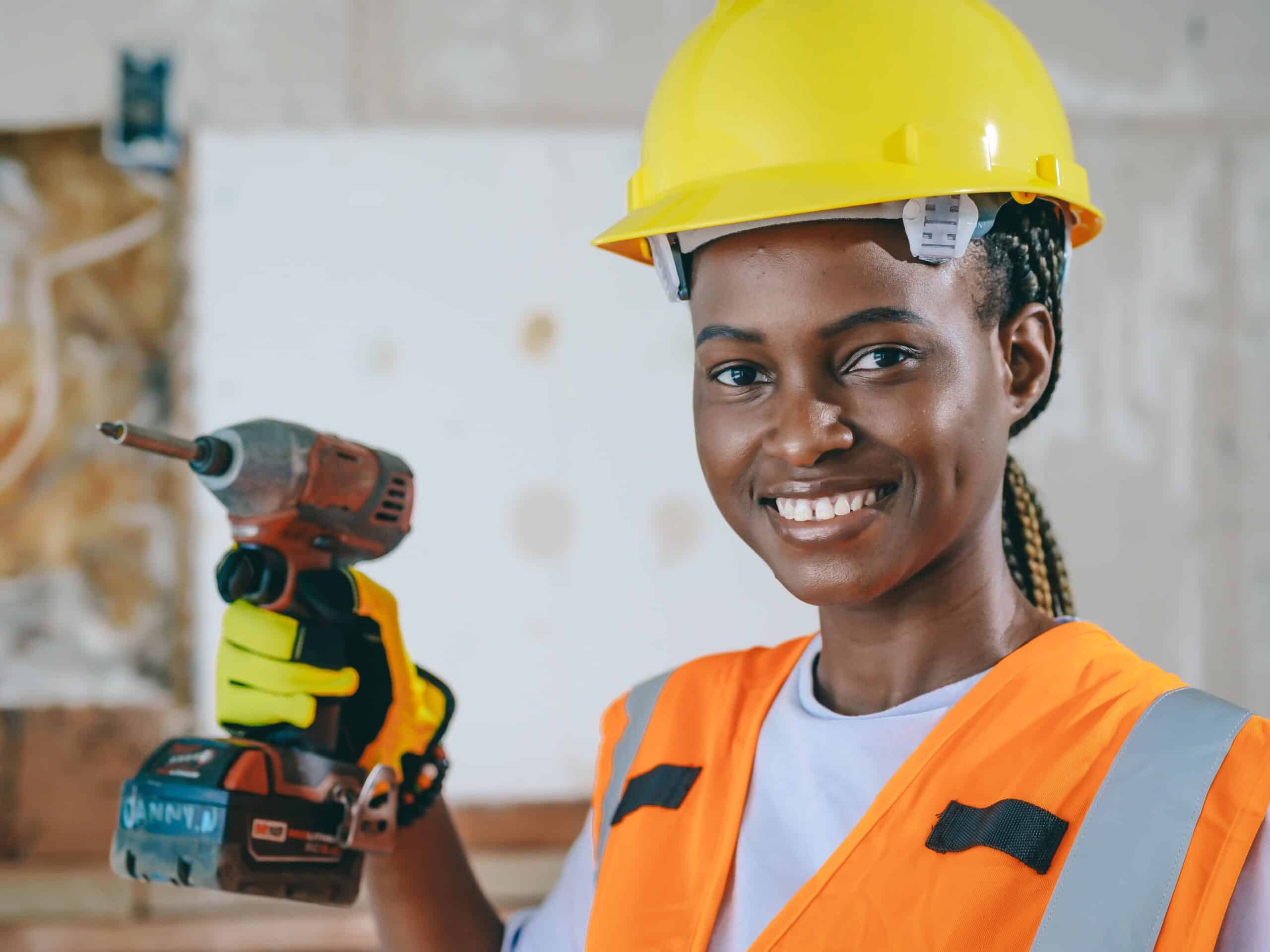 confident woman construction worker wearing a hard hat