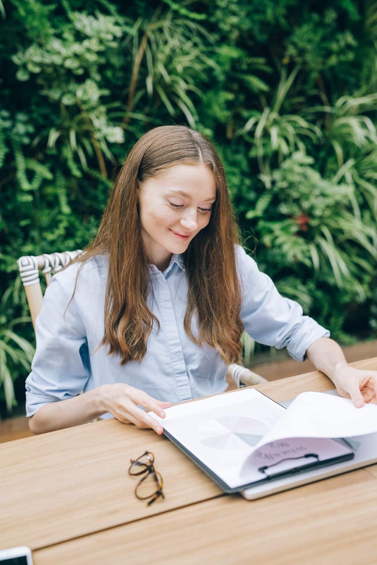 Woman sitting and planning her small business