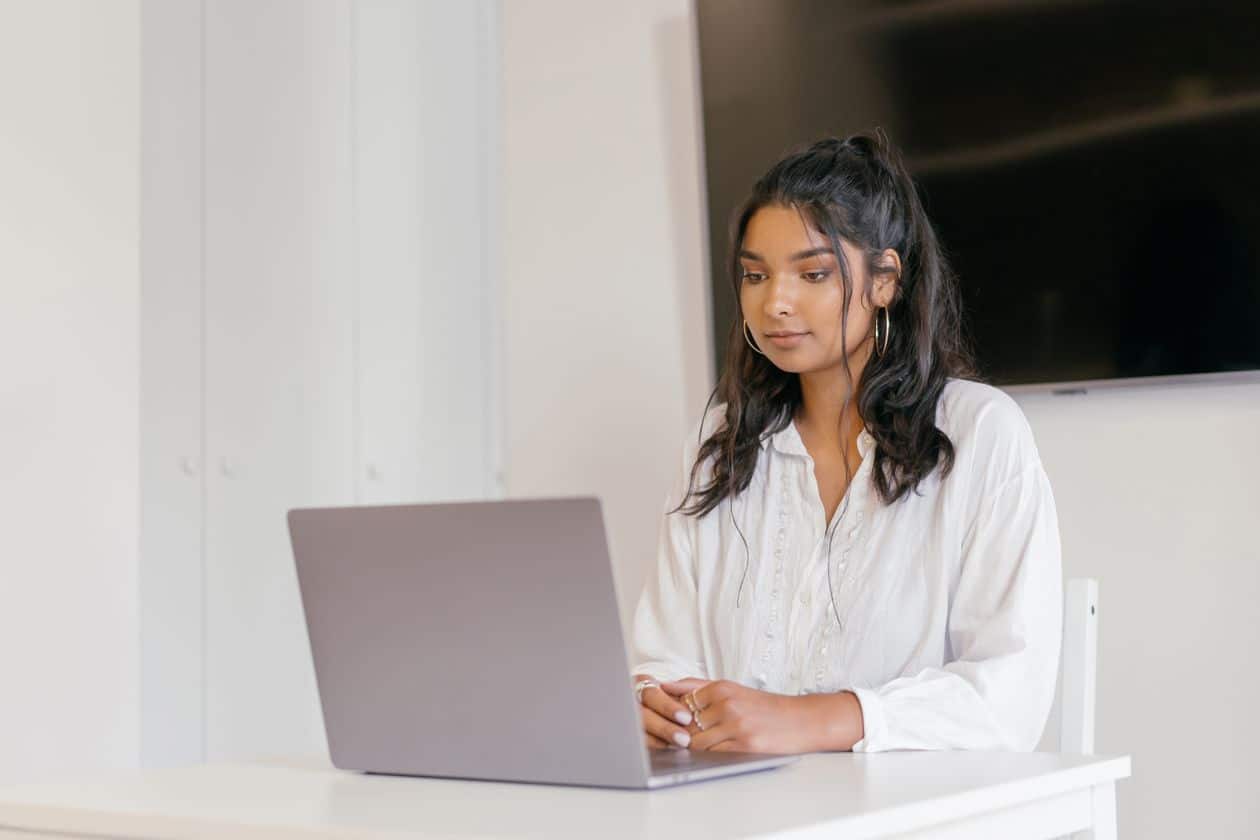 Woman completing an online certificate program on her laptop