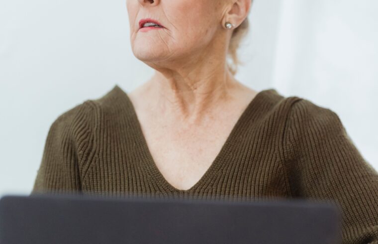 Mature woman working on a laptop from home during the holiday season